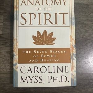 Anatomy of the Spirit Book by Caroline Myss - Cream and Brown